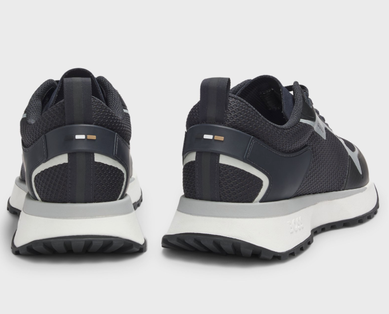 Mixed-material trainers with mesh details and branding