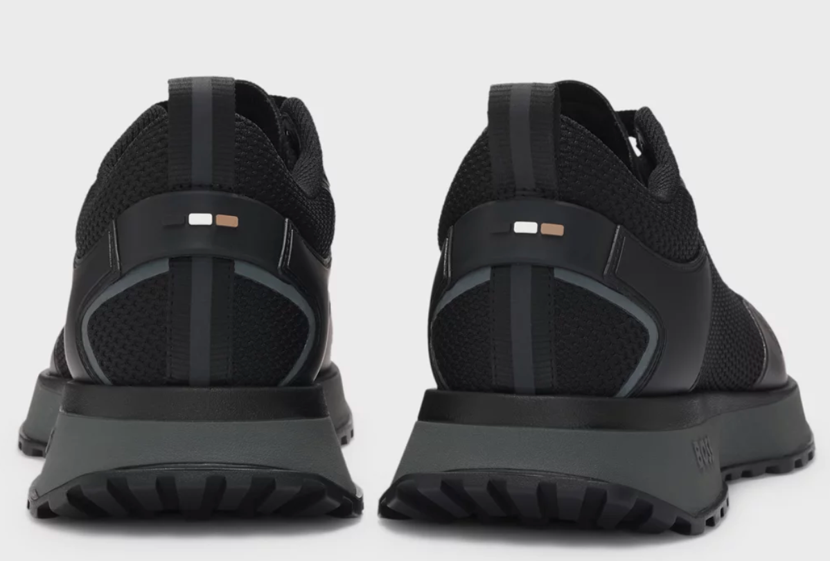 Mixed-material trainers with mesh details and branding